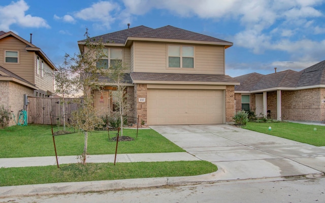 view of front of house featuring a front lawn and a garage