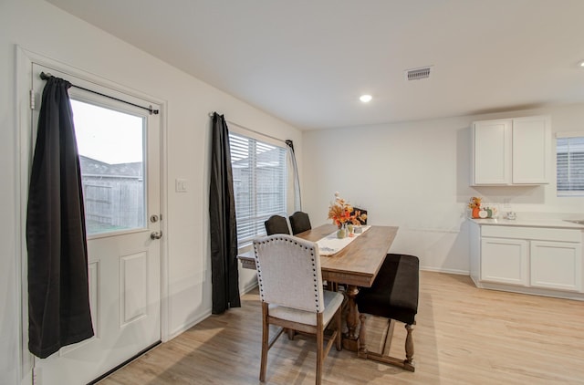 dining room featuring light hardwood / wood-style floors