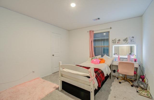 bedroom with light colored carpet