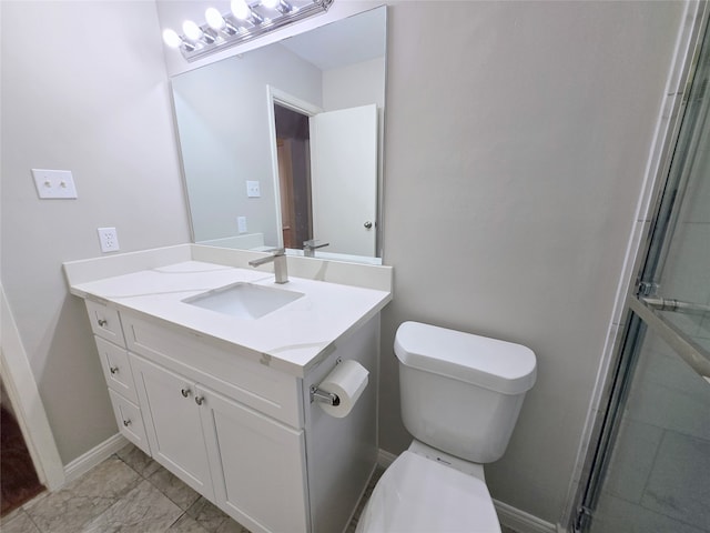 bathroom with walk in shower, vanity, and toilet