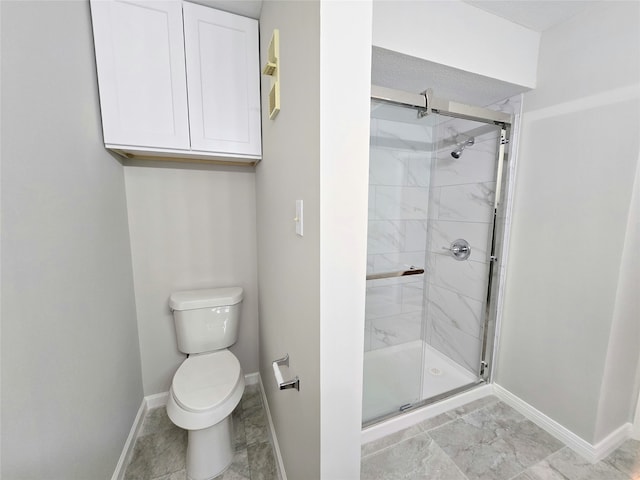 bathroom with toilet and walk in shower