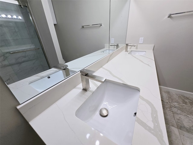 bathroom featuring vanity and an enclosed shower