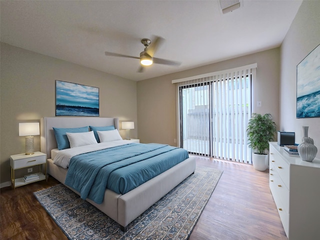 bedroom with access to exterior, ceiling fan, and hardwood / wood-style flooring