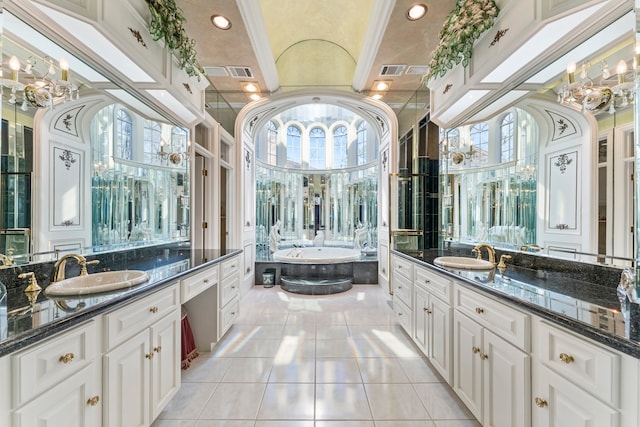 bathroom featuring vanity, tile patterned flooring, a relaxing tiled tub, and ornamental molding