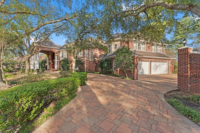 mediterranean / spanish-style home with a garage