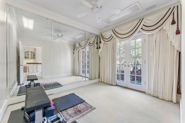 exercise area with light carpet, ceiling fan, and ornamental molding