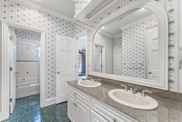 bathroom featuring tile patterned flooring, vanity, combined bath / shower with glass door, and crown molding