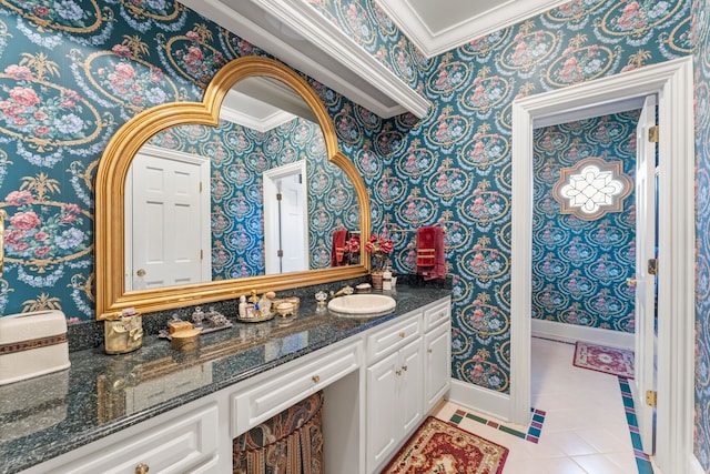 bathroom featuring tile patterned flooring, vanity, and ornamental molding