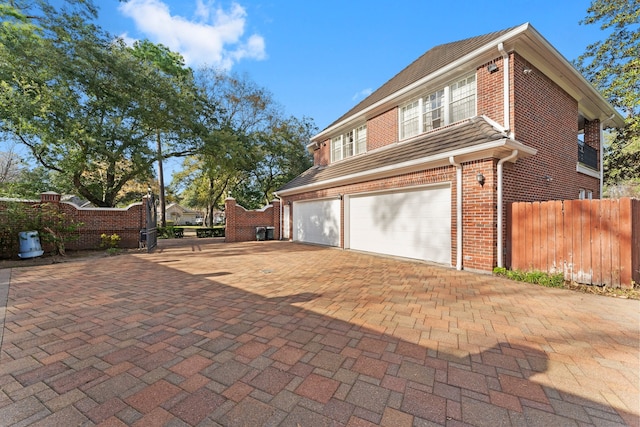 view of property exterior with a garage