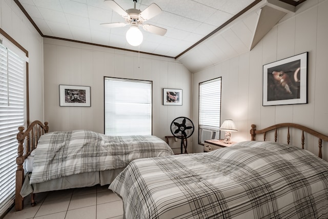 tiled bedroom with cooling unit, crown molding, wooden walls, vaulted ceiling, and ceiling fan