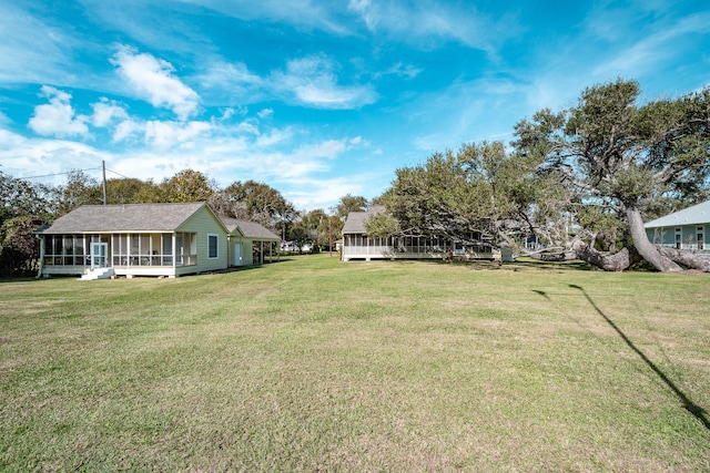 view of yard featuring a sunroom