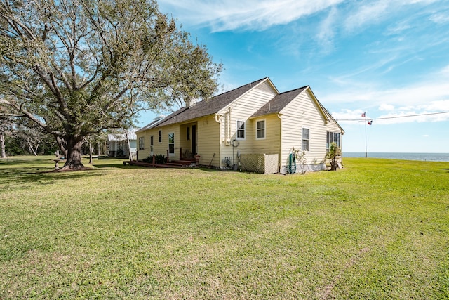 view of property exterior with a lawn