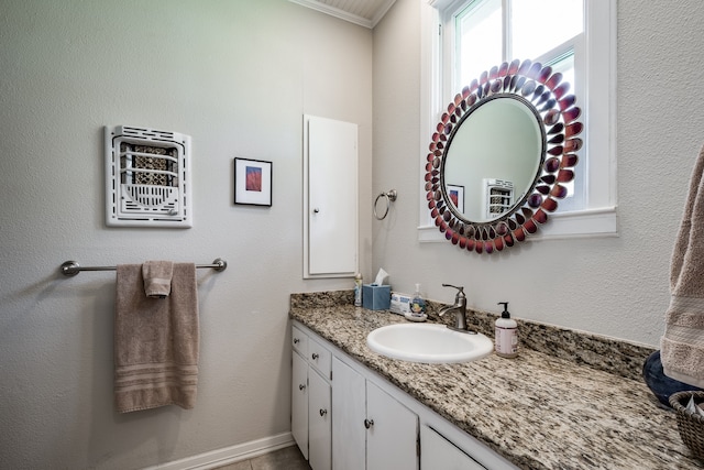 bathroom featuring vanity and ornamental molding