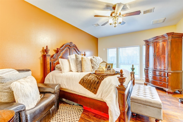 bedroom featuring ceiling fan and light hardwood / wood-style floors