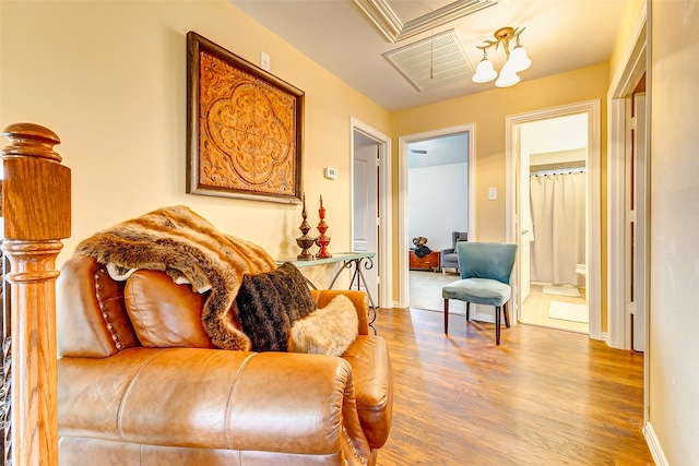 sitting room featuring hardwood / wood-style flooring