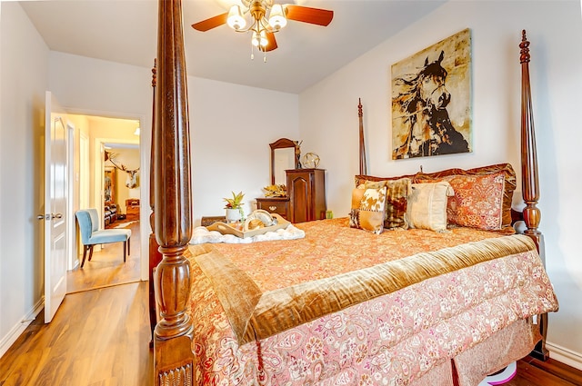 bedroom with ceiling fan and wood-type flooring