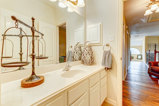 bathroom with wood-type flooring and vanity