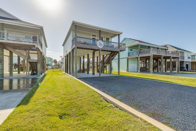 exterior space featuring a front lawn and a carport