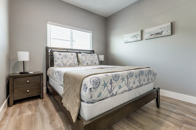 bedroom with light wood-type flooring