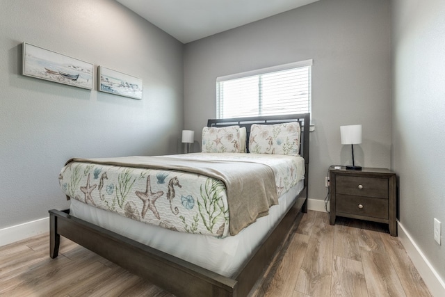 bedroom with light hardwood / wood-style floors