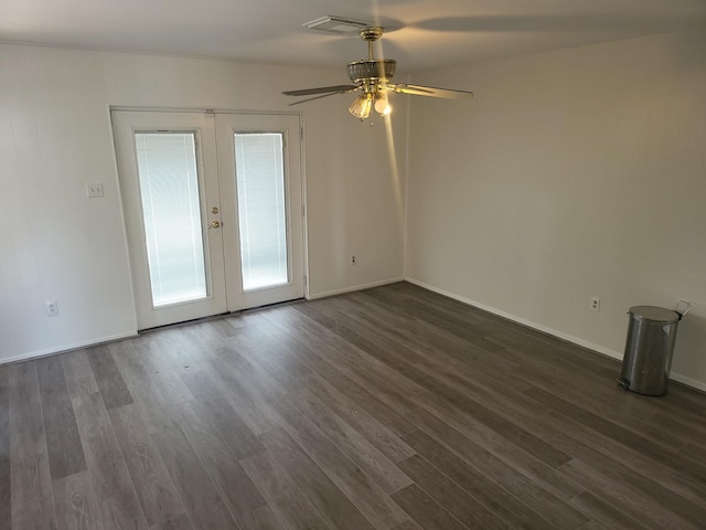 empty room featuring french doors, dark hardwood / wood-style flooring, and ceiling fan