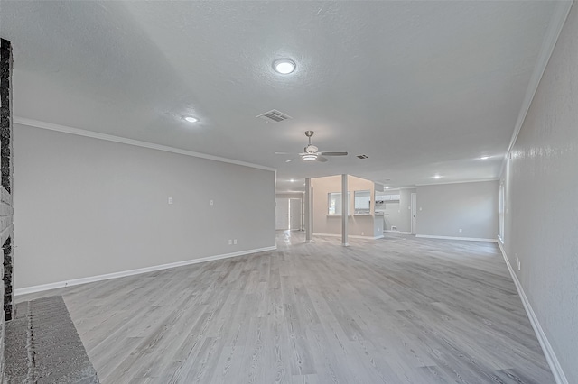 unfurnished living room featuring crown molding, light hardwood / wood-style flooring, ceiling fan, and a brick fireplace