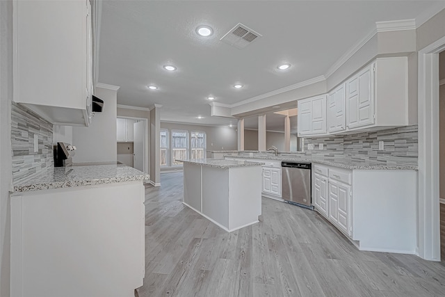 kitchen with white cabinetry, dishwasher, a center island, light hardwood / wood-style flooring, and kitchen peninsula