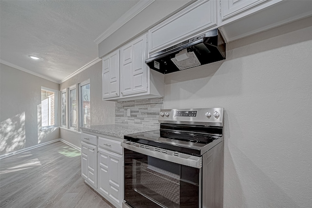 kitchen with white cabinetry, stainless steel electric range oven, backsplash, custom exhaust hood, and light wood-type flooring