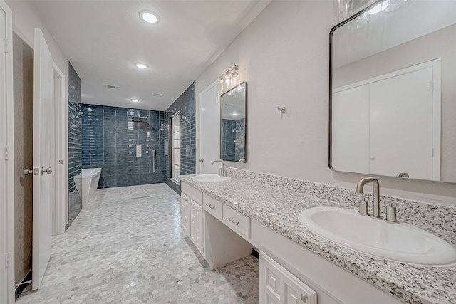 bathroom featuring vanity and plus walk in shower