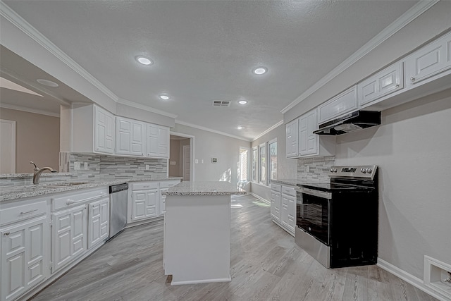 kitchen featuring light stone countertops, stainless steel appliances, white cabinetry, and light hardwood / wood-style floors