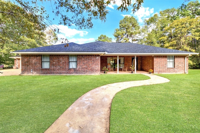 ranch-style home with a patio and a front yard