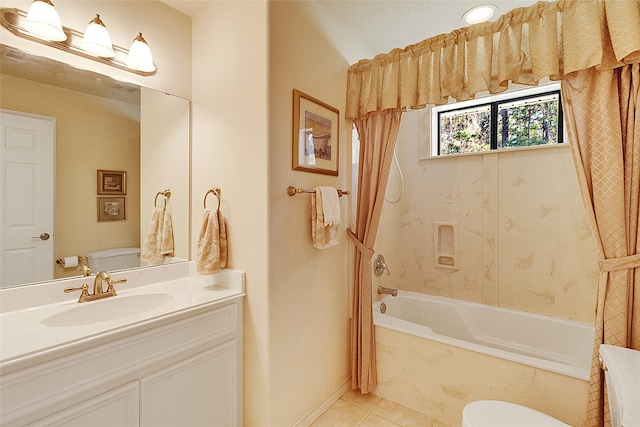 bathroom featuring tile patterned flooring, vanity, and toilet