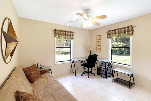 tiled office featuring ceiling fan and a healthy amount of sunlight