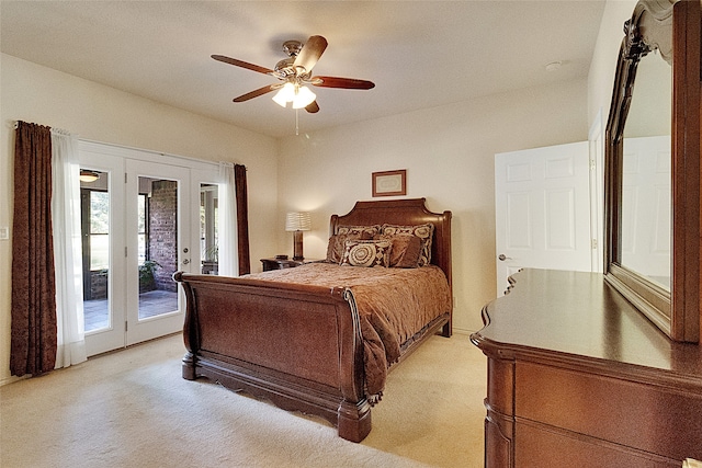 carpeted bedroom with access to outside, ceiling fan, and french doors