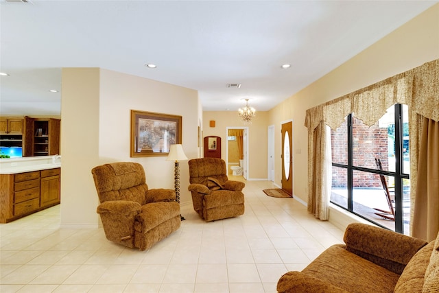 living room featuring light tile patterned floors and an inviting chandelier