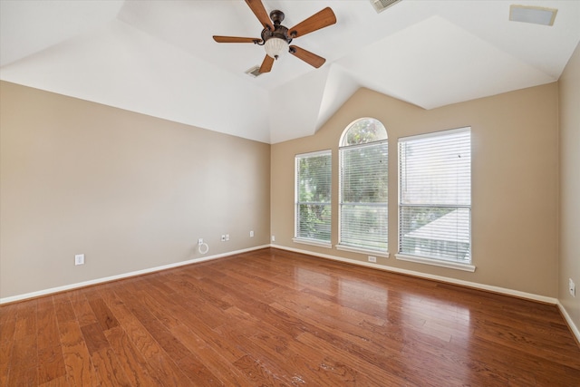 unfurnished room with ceiling fan, hardwood / wood-style floors, and vaulted ceiling