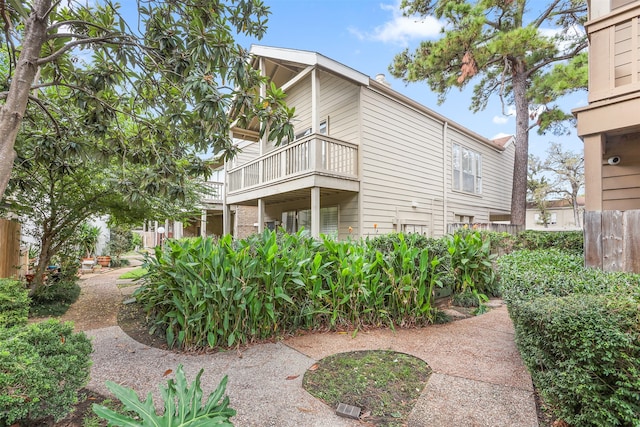 view of property exterior featuring a balcony