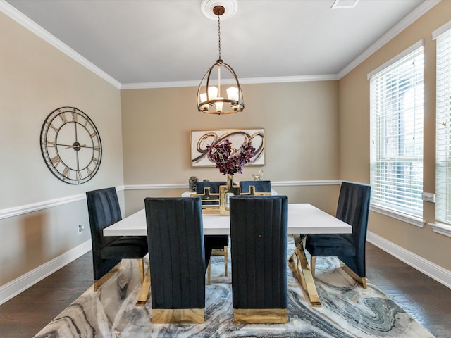 dining space featuring crown molding, plenty of natural light, dark wood-type flooring, and an inviting chandelier