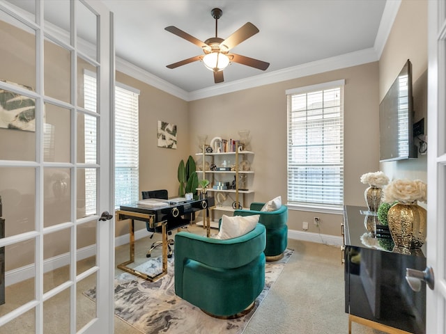 carpeted office with ceiling fan, crown molding, and french doors