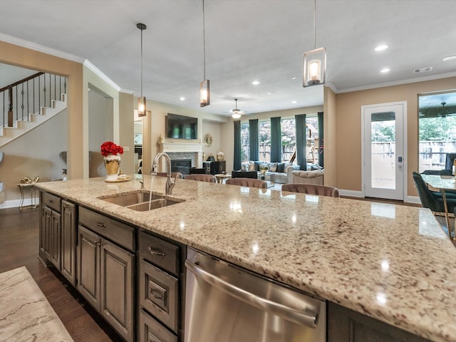 kitchen featuring light stone countertops, dishwasher, sink, dark hardwood / wood-style flooring, and crown molding