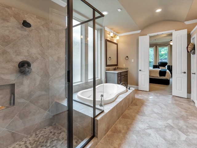 bathroom with ceiling fan, separate shower and tub, vaulted ceiling, vanity, and ornamental molding