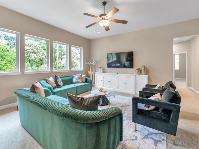 living room with ceiling fan and light carpet