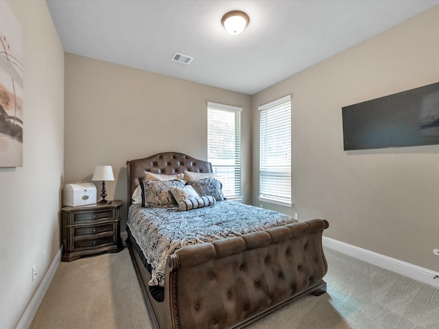 bedroom featuring light colored carpet