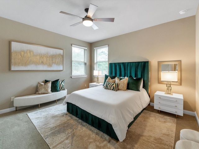 bedroom with light carpet and ceiling fan