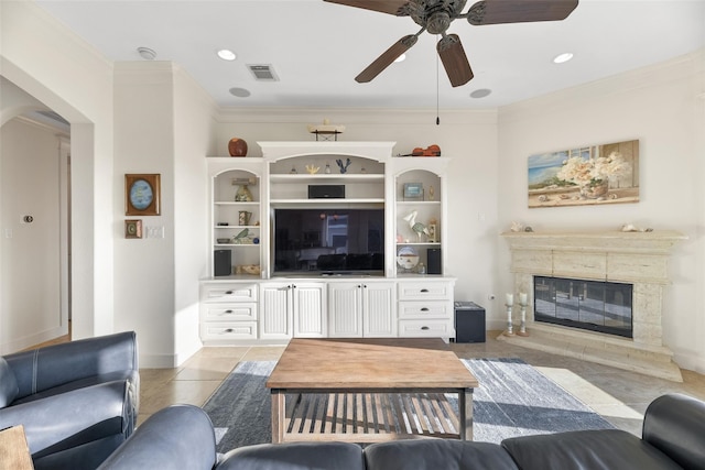 tiled living room featuring ceiling fan and ornamental molding