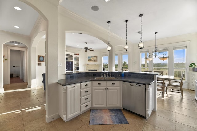 kitchen with sink, stainless steel dishwasher, ceiling fan, decorative light fixtures, and white cabinetry