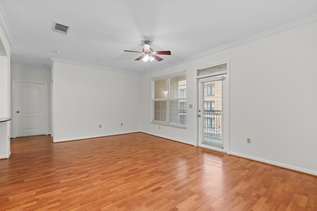 spare room with light wood-type flooring, ceiling fan, and ornamental molding