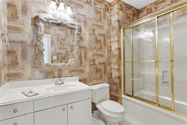 full bathroom with tile patterned flooring, toilet, shower / bath combination with glass door, wooden walls, and vanity