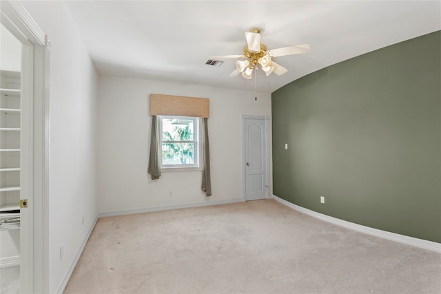 carpeted empty room with ceiling fan