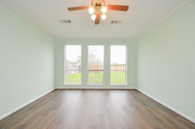 empty room featuring hardwood / wood-style floors, ceiling fan, and crown molding